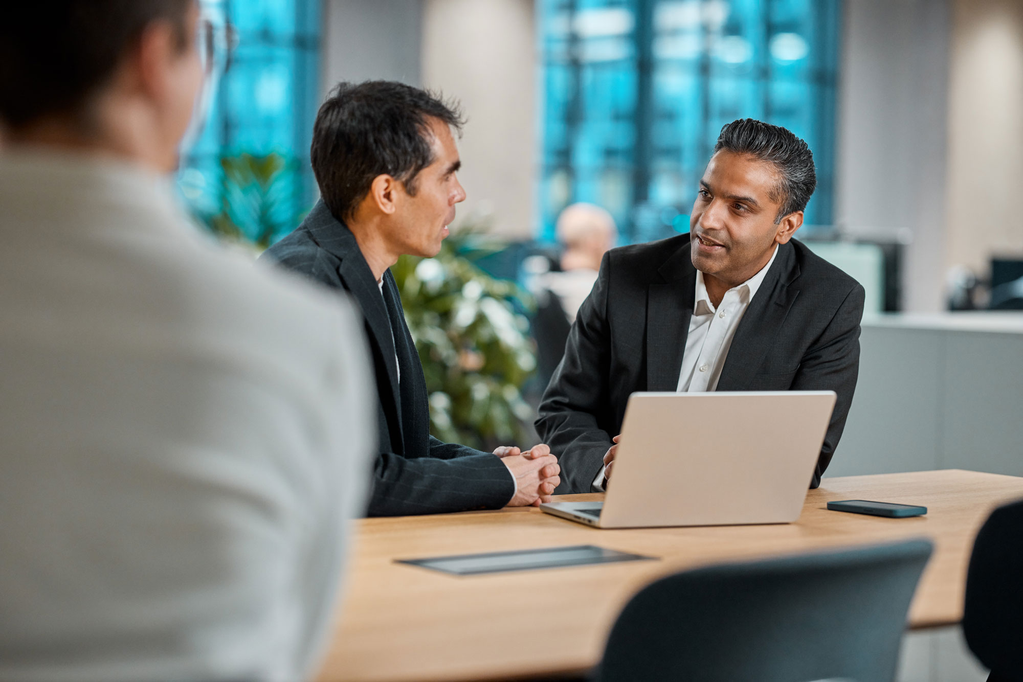 Two coworkers discussing
